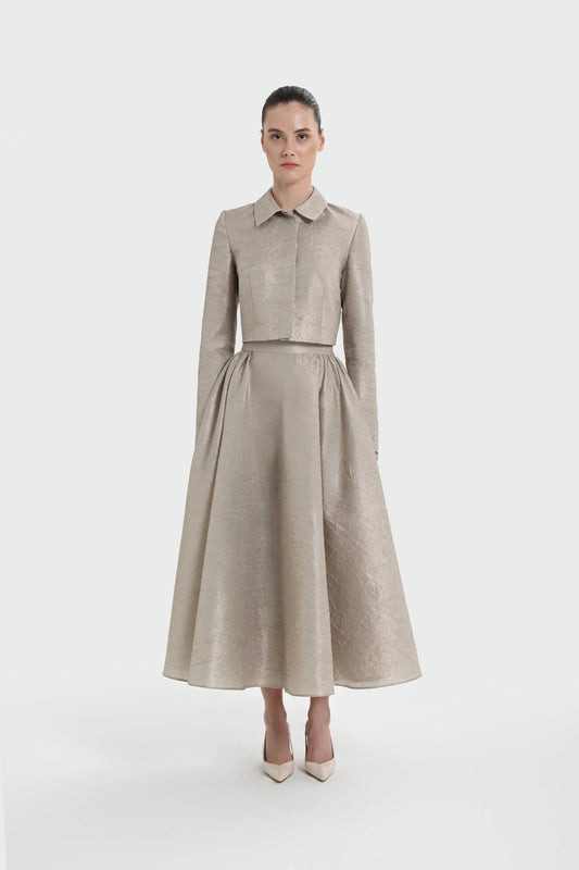 Elegant champagne two-piece set featuring a structured top and a flowing A-line skirt. 9175